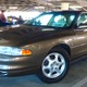 Illustration for article titled This Mint 1999 Oldsmobile Intrigue Led a Pack of Heroes at Radwood LAem/em
